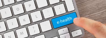 Das Bild zeigt eine Tastatur, wobei auf einer Taste "e-Health" steht.